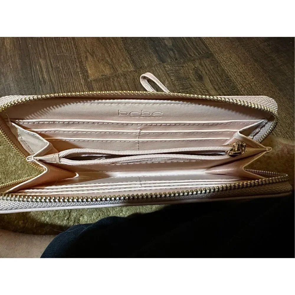 BEBE Pink and gold, large wristlet. Lots of room never used.